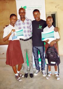 Student Beneficiaries of the IAF Scholarship, a teacher and the IAF Education Ambassador, Vincent Adeoba