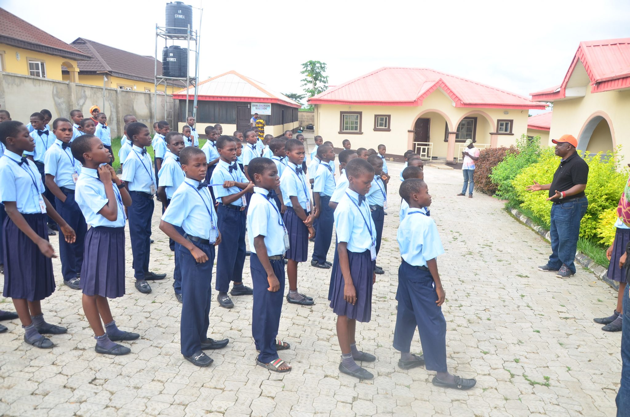 Oba Abolarin addressing the full student body on the assembly ground