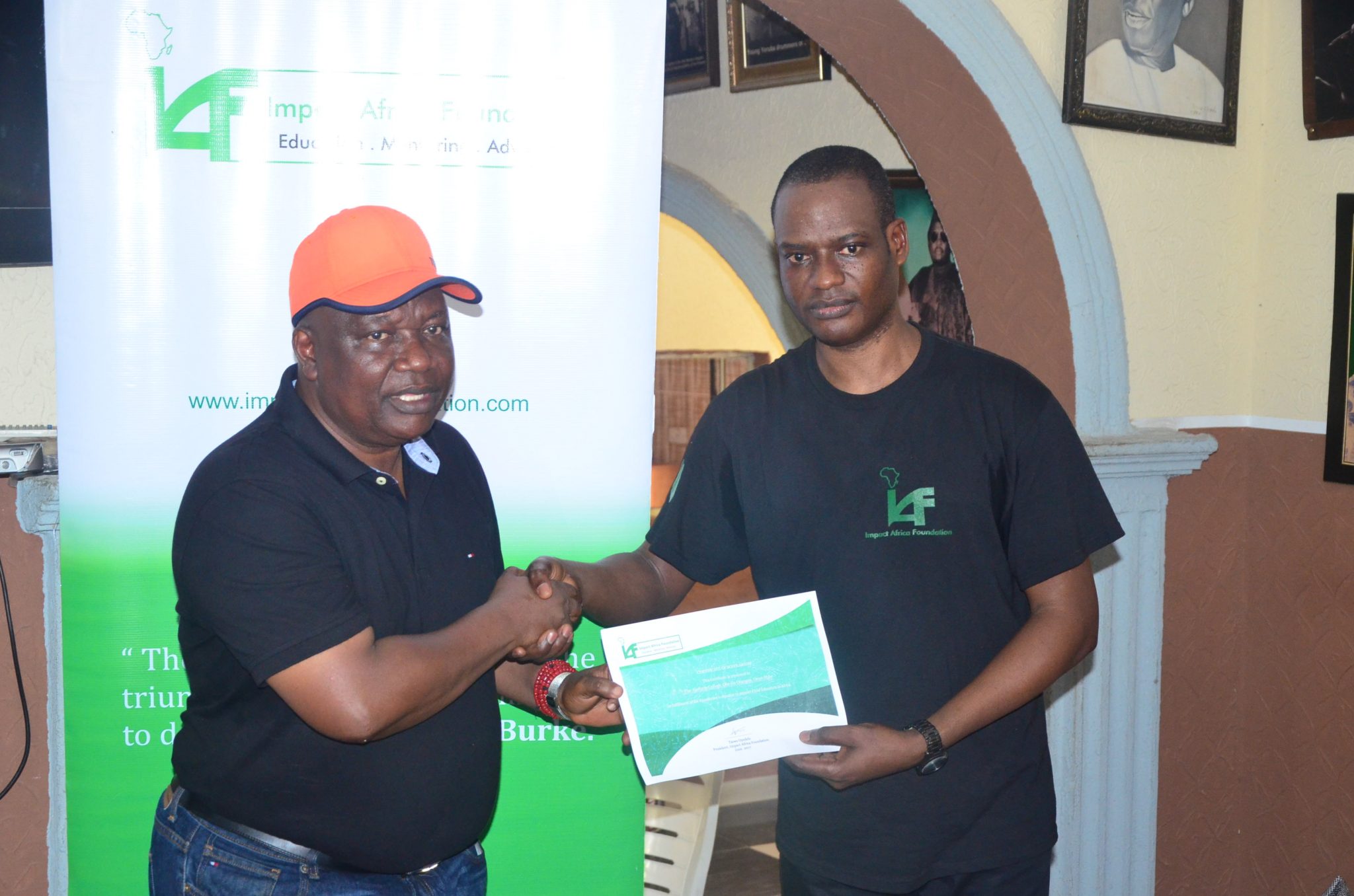 Taiwo Oyedele of PwC presenting scholarship certificate to Oba Abolarin